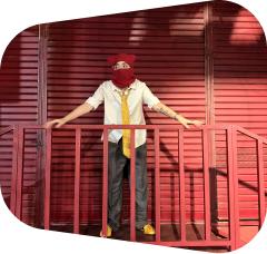 ARTA standing at a red railing